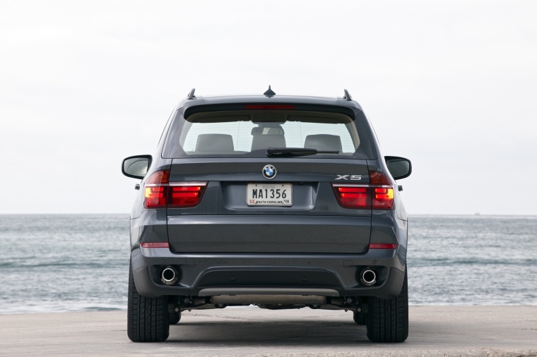 2013 BMW X5 xDrive50i in Sparkling Bronze Metallic from a rear view